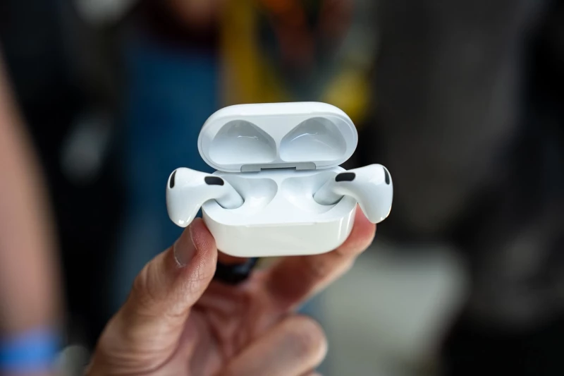 The new AirPods 5 in their charging case.